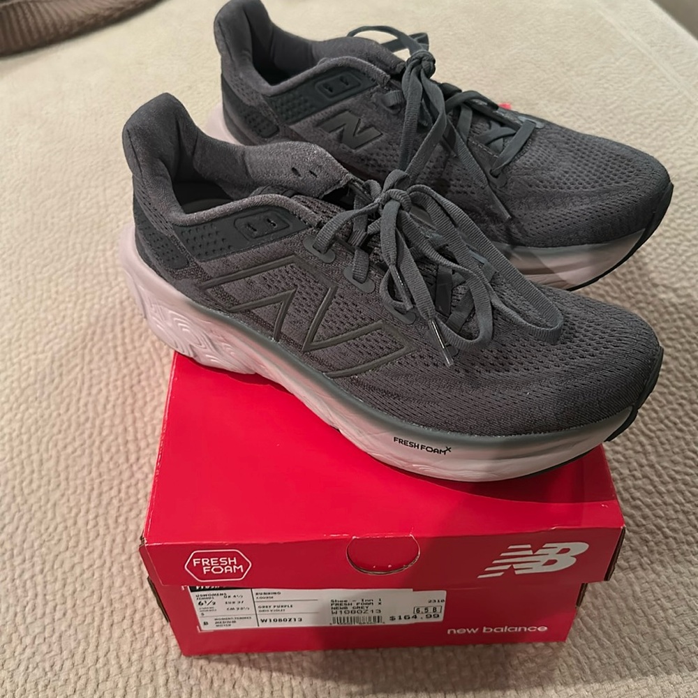 New balance worn twice size 6.5.  I needed 6 love the shoe but slip on ankle.